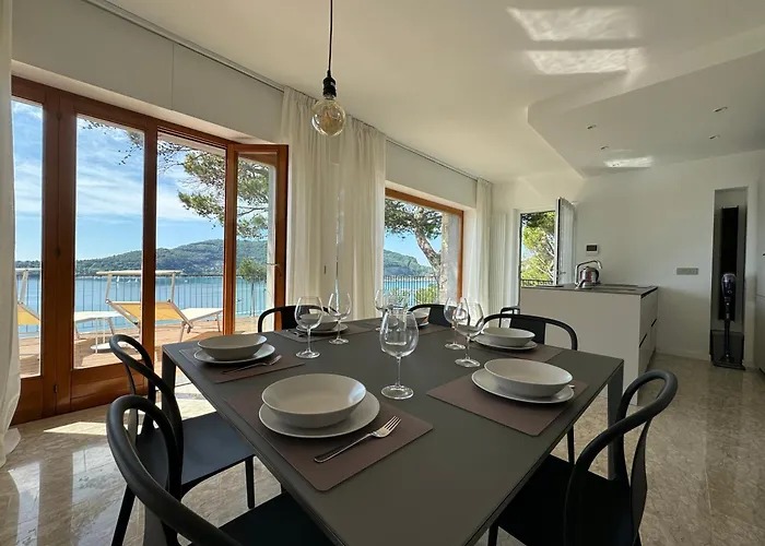 Modern And Elegant With A Spacious Sea View Terrace Overlooking Palmaria Island Bright Designer Interiors Fully Equipped Up To 6 Guests Private Parking Aircon The Comforts For A Perfect